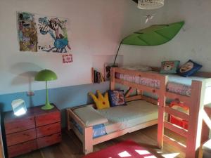 a childs bedroom with a bunk bed with an umbrella at Casa Matta in Arezzo