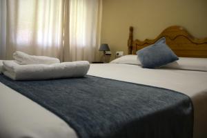 Posteľ alebo postele v izbe v ubytovaní Hostal Valdepeñas by Bossh! Hotels