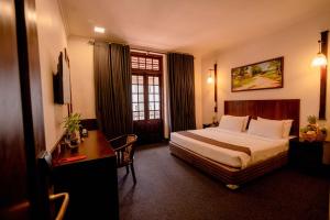 Rúm í herbergi á Hotel Nippon Colombo