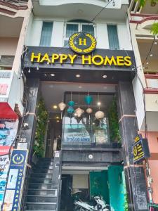 a happy homes sign on the front of a building at Happy Hotel in Ho Chi Minh City