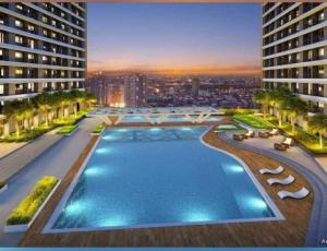 una vista aérea de un edificio con piscina en Lovely Fame@5SYu, en Manila