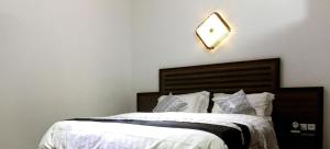 Llit o llits en una habitació de Mosaly Residence Caboma