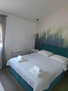 Postel nebo postele na pokoji v ubytování Apartmani Drijen