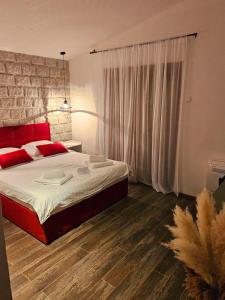 Postel nebo postele na pokoji v ubytování Apartmani Drijen