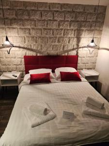 Postel nebo postele na pokoji v ubytování Apartmani Drijen