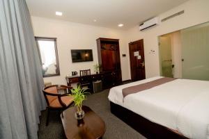 Rúm í herbergi á Hotel Nippon Colombo