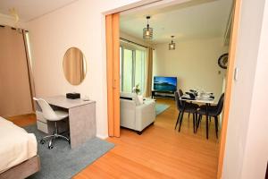 a room with a living room and a dining room at 1BR Apartment Retreat for Your Getaway In Al Muneera in Abu Dhabi +47 photos