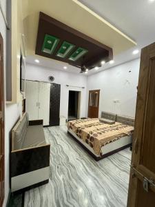 a large room with a bed in the middle of it at AB guest house { home stay} in Bikaner