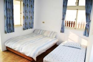 Postel nebo postele na pokoji v ubytování Caramel Macchiato Homestay