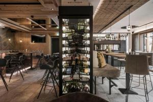 a room with a wine rack filled with wine bottles at SonnenHOF hotel gerlos centrum in Gerlos