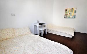 Postel nebo postele na pokoji v ubytování Caramel Macchiato Homestay