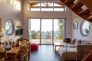 a living room with a couch and a table at Ionian Dream Villas in Lefkada Town