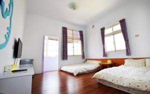 A bed or beds in a room at Caramel Macchiato Homestay