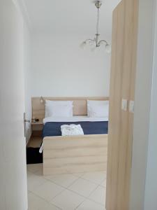 Postel nebo postele na pokoji v ubytování WING 3 apartman ,,BC ,,