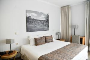 Postel nebo postele na pokoji v ubytování Amoras Country House Hotel
