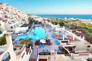 an aerial view of a resort with a swimming pool at Ramada Costa Adeje Apartment in Adeje