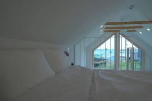 Ένα ή περισσότερα κρεβάτια σε δωμάτιο στο Sodara Tiny House