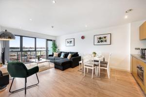 a living room with a couch and a table at Host & Stay - The Waterfront Hideaway in Liverpool