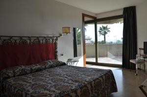 Postel nebo postele na pokoji v ubytování Hotel Villa Undulna - Terme della Versilia
