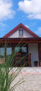 a small house with a red roof at Holiday Old stone house in Sveti Ivan Zelina