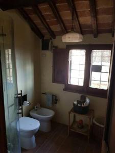 a bathroom with a toilet and a sink at il sogno di Civita in Bagnoregio