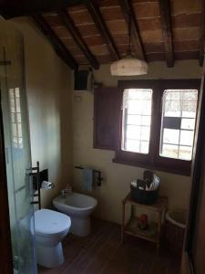 a bathroom with a toilet and a sink at il sogno di Civita in Civita di Bagnoregio