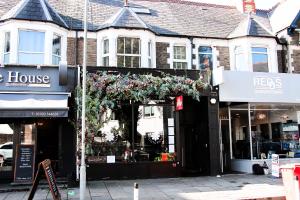 a store with a flower arrangement in the front of a building at Boutique 2 Bedroom Apartment In Pontcanna Cardiff in Cardiff