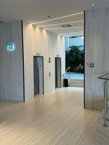 a lobby with two elevators in a building at Sea side 87 Sweet Me Eilat אילת in Eilat