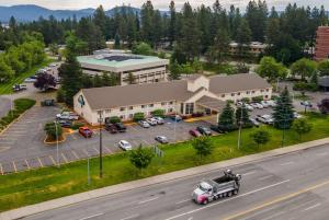 an aerial view of a building with a parking lot at Days Inn by Wyndham Coeur d'Alene in Coeur d'Alene