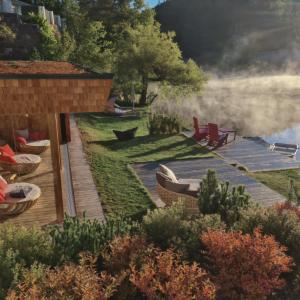 a rendering of a garden with chairs and a wooden deck at Hotel Weihrerhof in Soprabolzano