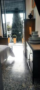 a kitchen with a bed and a sink in a room at Casa Pancrazia in Taormina