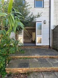 a front door of a house with a porch at Poplar Cottage Farnborough Kent in Orpington