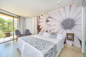 A bed or beds in a room at Barceló Illetas Albatros - Adults Only