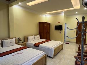 Postel nebo postele na pokoji v ubytování Thien Son Guesthouse