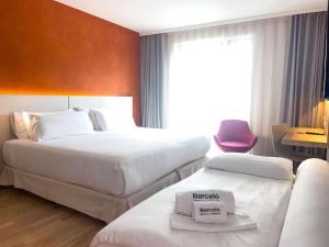 Uma cama ou camas num quarto em Barceló Hamburg