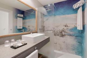 a bathroom with a sink and a shower at Barceló Lanzarote Active Resort in Costa Teguise