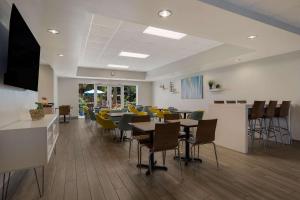 a dining room with tables and chairs in a restaurant at MainStay Suites Wilmington in Wilmington