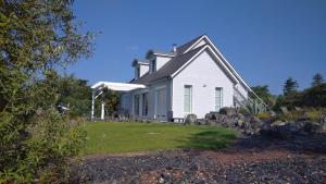 a white house with a gambrel roof at La Gilleterie in Varades