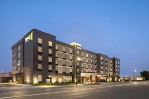 a rendering of a hotel on a street at night at Home2 Suites By Hilton Milwaukee West in West Allis