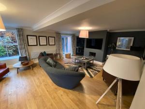 a living room with a couch and a table at Beautiful country house in Inkpen in Inkpen