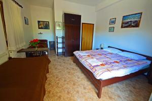 Postel nebo postele na pokoji v ubytování Villa Goga