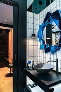a bathroom with a sink and a mirror at BILBAO DREAMS Luxury in Bilbao +34 photos