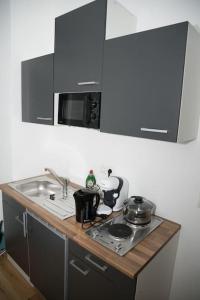 Η κουζίνα ή μικρή κουζίνα στο RRooms Smart Appartement