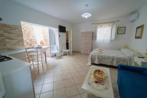 Ένα ή περισσότερα κρεβάτια σε δωμάτιο στο Tenuta Rosa Casa Salento Holidays +36 φωτογραφίες