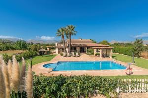 a villa with a swimming pool and a house at Villa Camp del Bosch by Sealand Villas in El Port