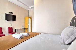 Postel nebo postele na pokoji v ubytování Hotel Jelita Mentawai Redpartner
