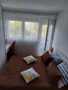 Postel nebo postele na pokoji v ubytování Apartman OMANOVIĆ