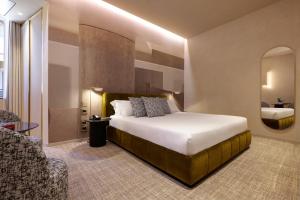 Postel nebo postele na pokoji v ubytování Borghese Contemporary Hotel
