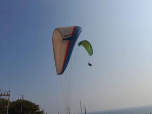 a large kite is flying in the sky at AARONIC STAY in Varkala