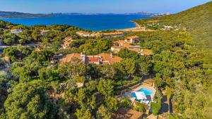 an aerial view of a house on a hill next to the ocean at VILLA STELLA 6, Emma Villas in Arzachena